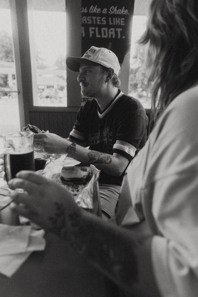 a man smiles on a date with his fiancee