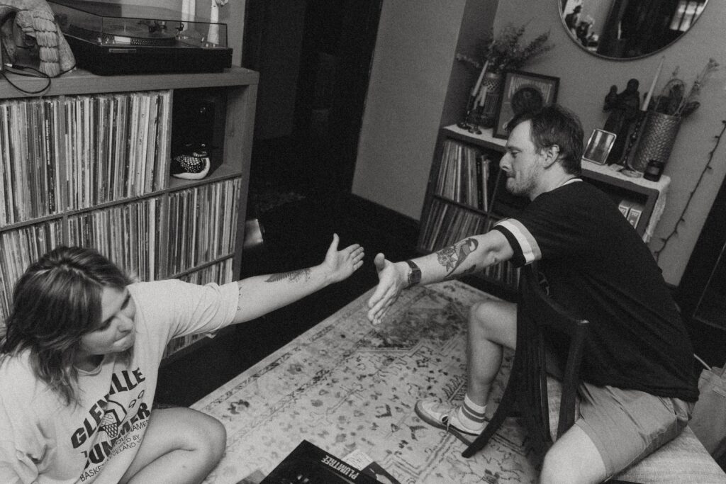 a couple dap each other up during their couples photography