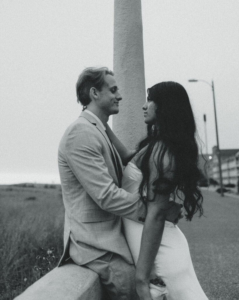 a couple lean against each other and smile during their elopement in oregon