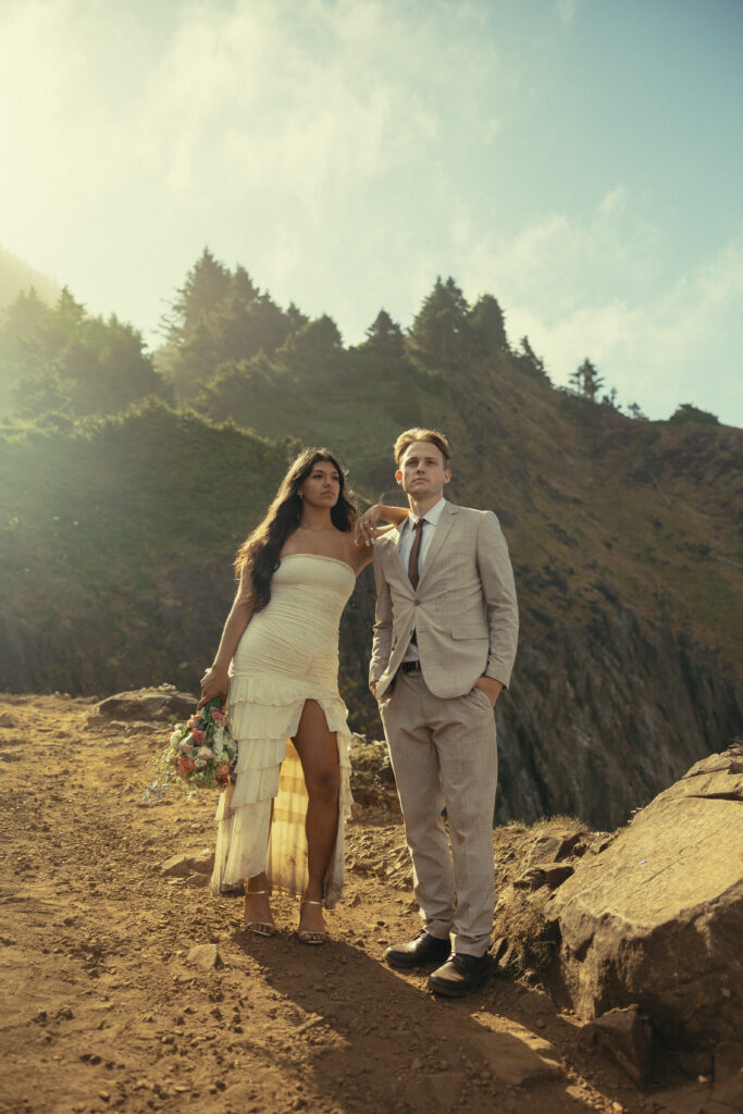 a woman rests her arm on her husband's shoulder during their oregon elopement