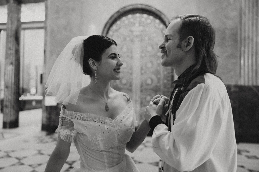 A black and white image of a couple in their wedding attire taken by Michigan elopement photographer, Anika B Photography