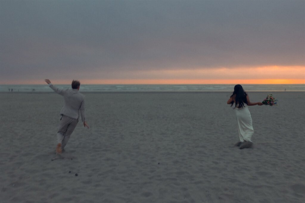 A Michigan couple celebrates their elopement on the beach, one of the places to elope in Michigan