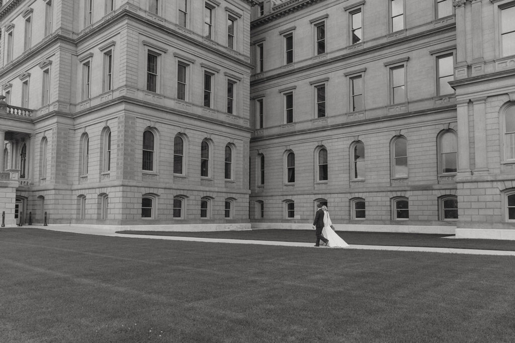 a black and white image of a couple in their wedding attire while eloping in michigan