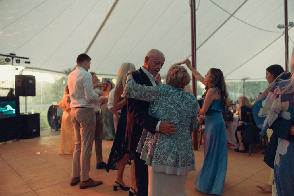 documentary style wedding photos, couples on the dance floor slow dance