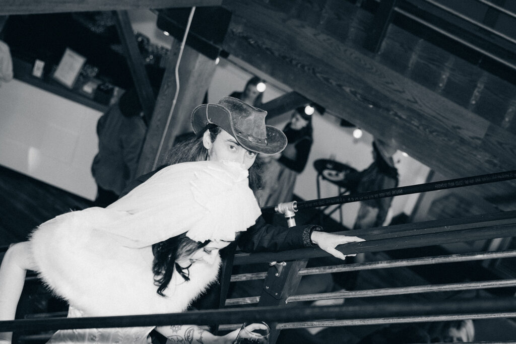 A black and white photo shows a bride & groom exiting their reception at The Record Box, one of many unique wedding venues in grand rapids mi