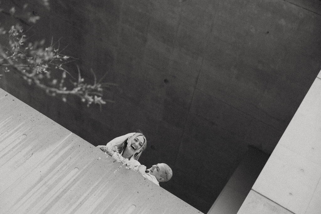 B+W image of Michigan newlyweds taken outside the Grand Rapids Art Museum before their Kent County courthouse wedding 