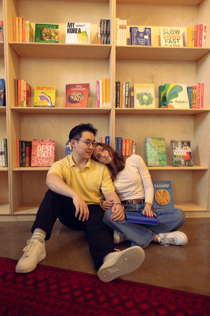 A photo of a Michigan couple taken by Detroit engagement photographer at a locally owned bookstore 