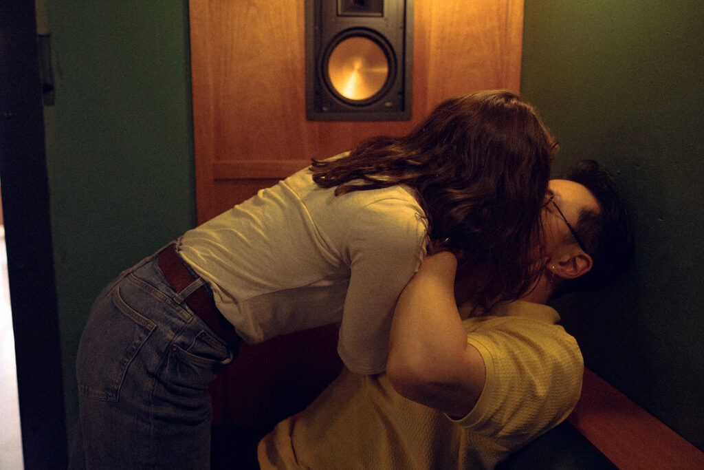 A cinematic photo of a MI couple sharing a kiss during a session with Detroit engagement photographer, Anika B Photography 