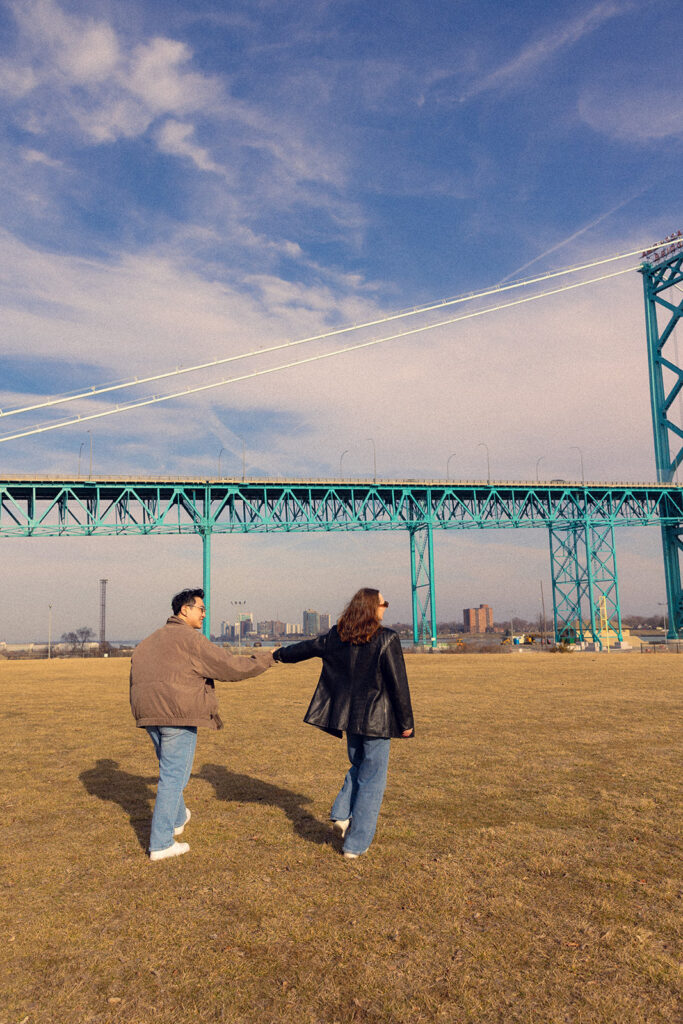 A recently engaged couple is photographed at one of the outdoor options for detroit engagement photo locations