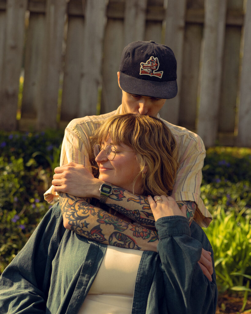 Michigan engagement photo shows a couple embracing in their back yard