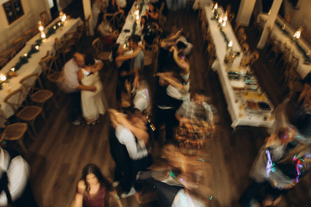 An editorial photo of wedding guests dancing at a popular location for wedding receptions in west michigan