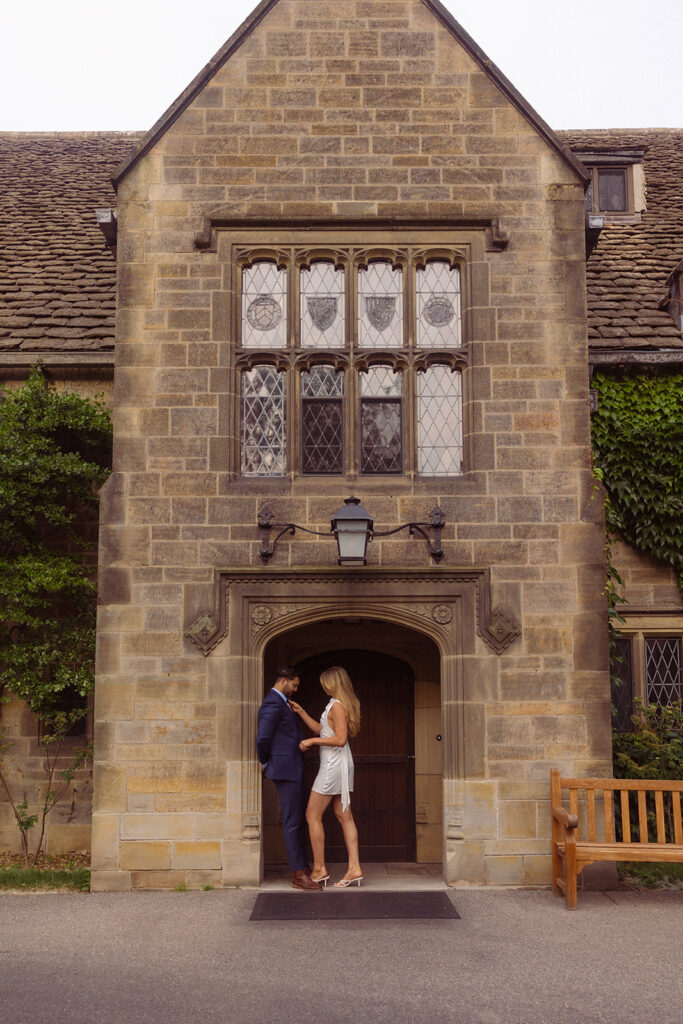 A Michigan couple pose for an engagement session in the entryway at the Ford House Grosse Pointe 